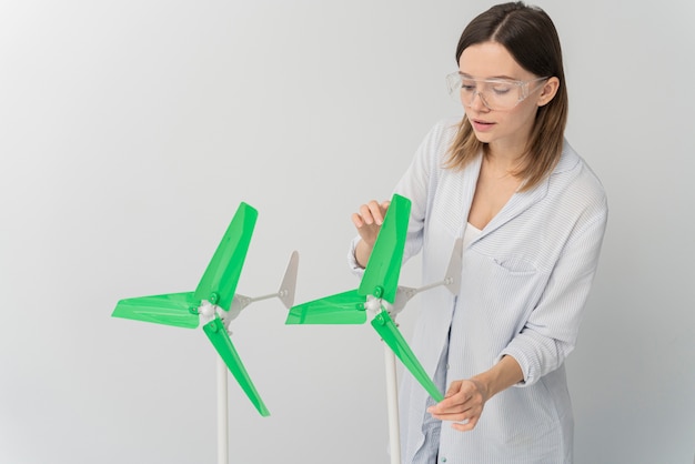 Free Photo woman showing wind energy innovation