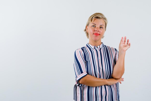 Woman shows sprinkle with hands on a white background