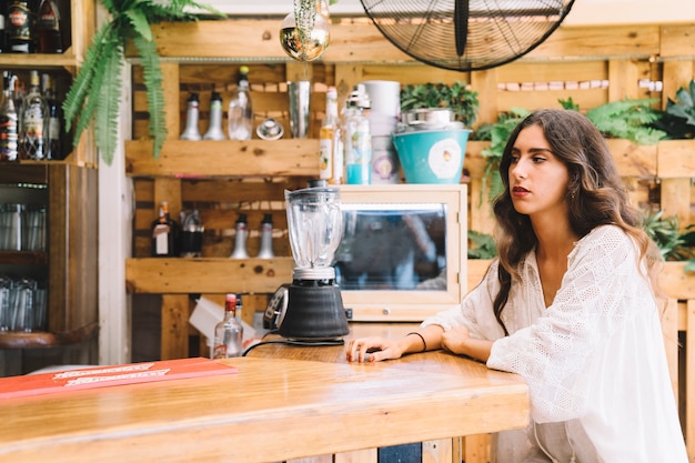 Woman sitting at bar