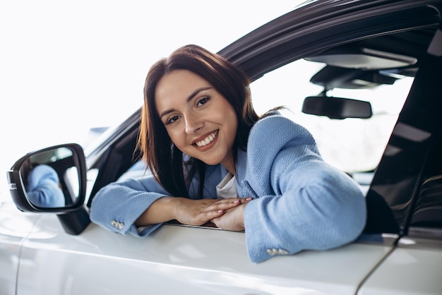 Woman sitting in her new car