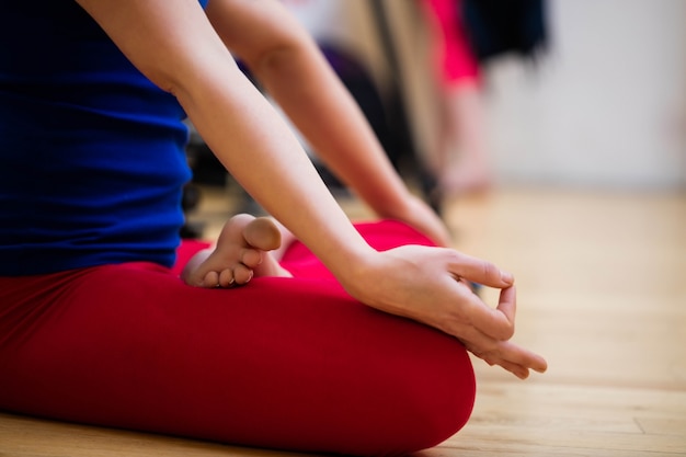 Woman sitting in lotus position