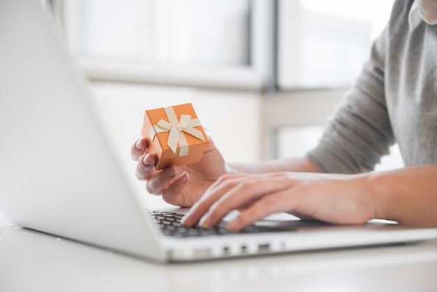 Woman sitting at table with laptop