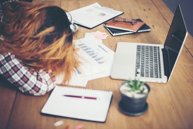 Woman sleeping at the office