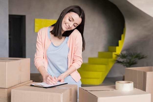 Woman on smartphone taking work orders from home