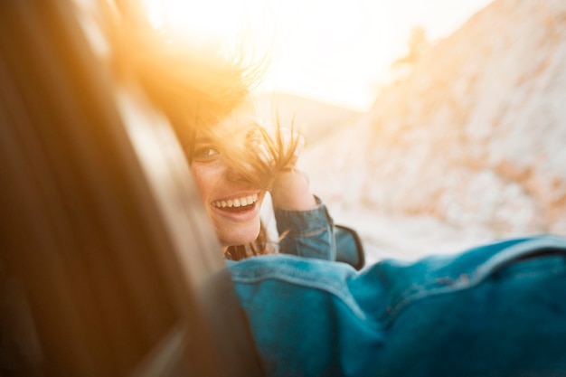 Free photo woman smiling while being in a car ride