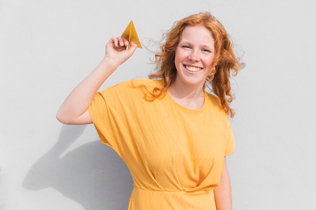 Free photo woman smiling with plane