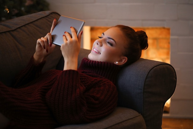 Woman on the sofa with a tablet