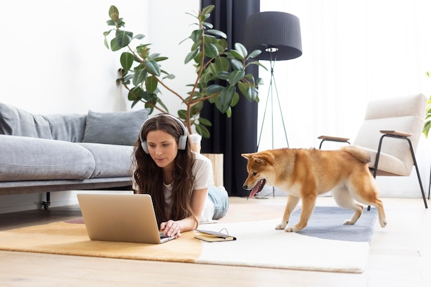 Free Photo woman spending time together with her dog