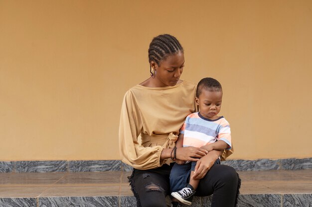 Woman spending time with her black baby boy