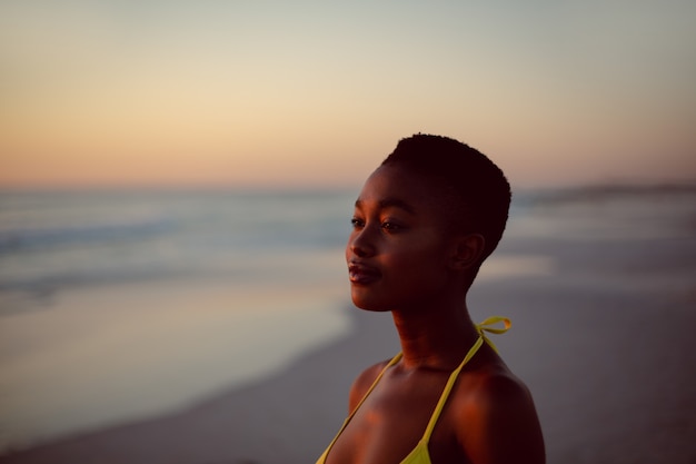 Woman standing on the beach