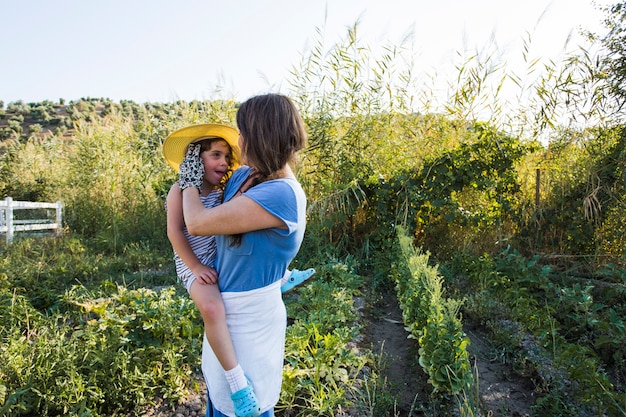 Woman standing in the field loving her friend