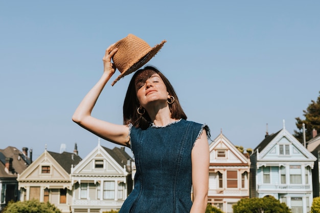 Free Photo woman standing in front of the painted ladies of san francisco, usa