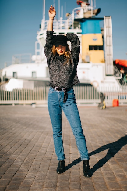 Woman standing in front of ship