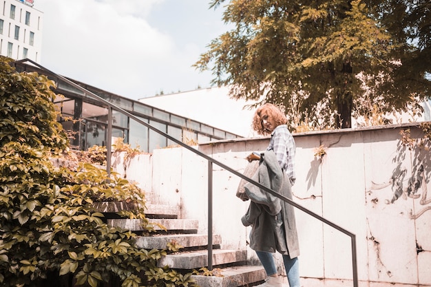 Free photo woman standing on steps