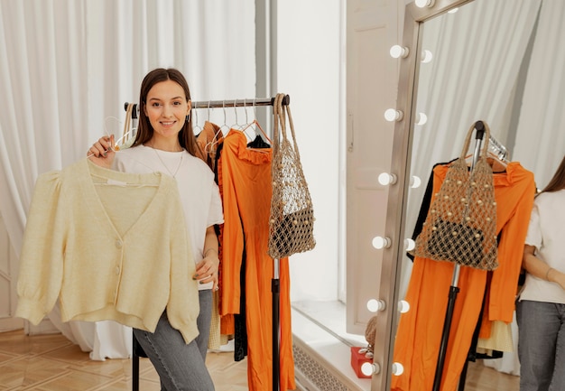 Woman in store trying on clothes