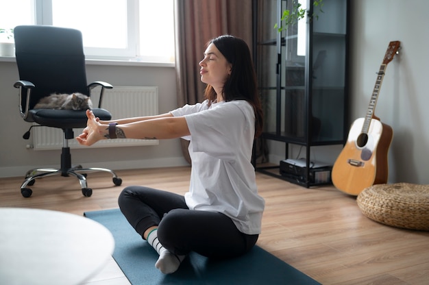 Woman streching at home during quarantine