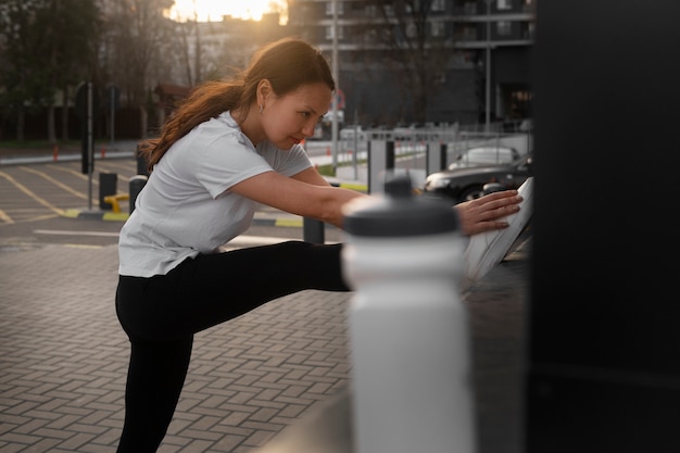 Woman stretching before working out outdoors