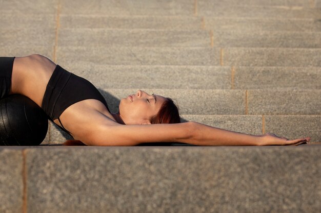 Woman stretching and preparing for exercise outdoors