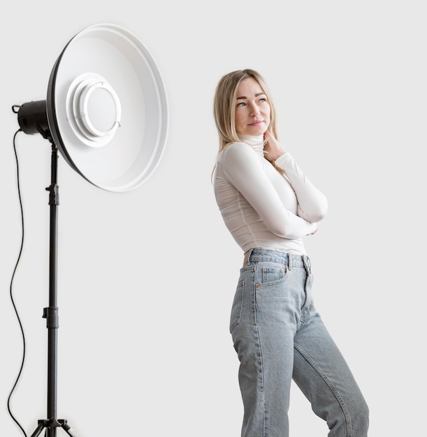 Free Photo woman and studio lamp photo art concept