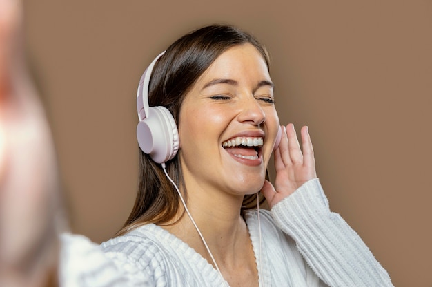 Woman in studio listening to music