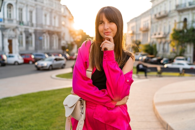 Free Photo woman in stylish casual outfit posing in old european city.