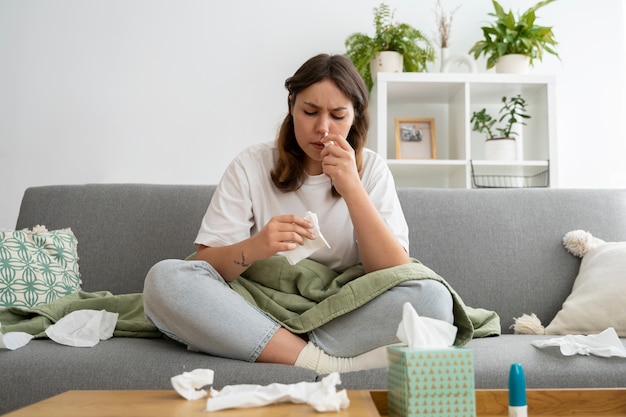 Woman suffering from allergy front view