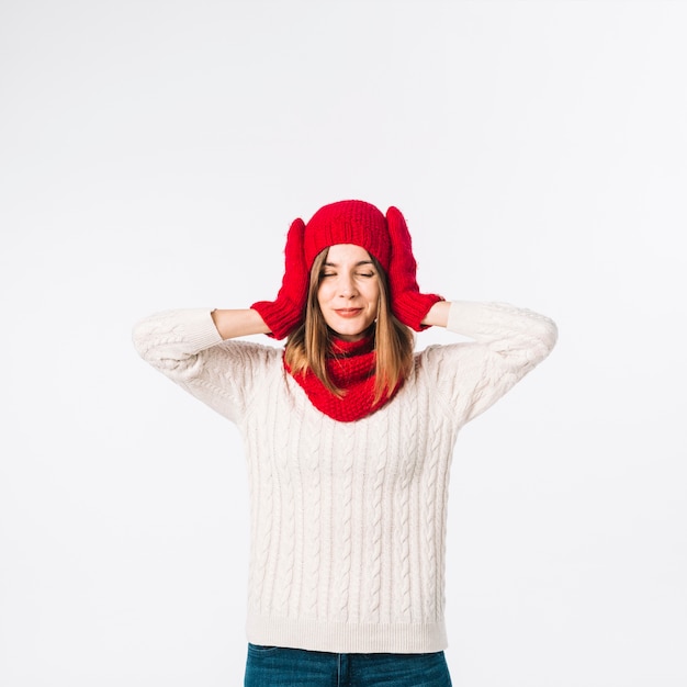 Free photo woman in sweater covering ears