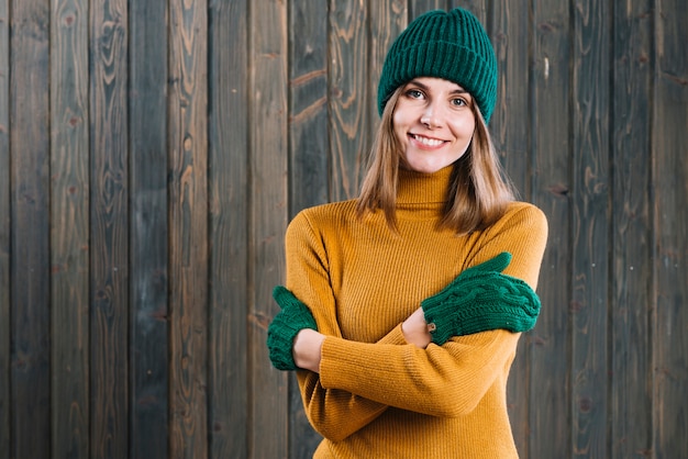 Free photo woman in sweater crossing arms on chest