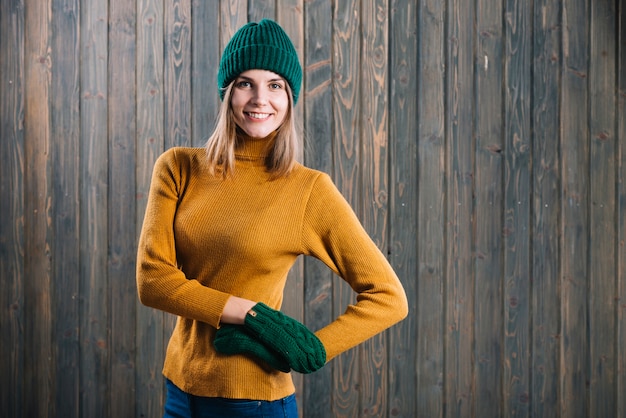 Free photo woman in sweater holding hands on hip