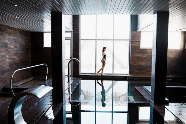 Woman next to swimming pool in spa