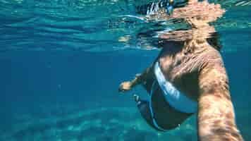 Free photo woman swimming under the water, mediterranean sea