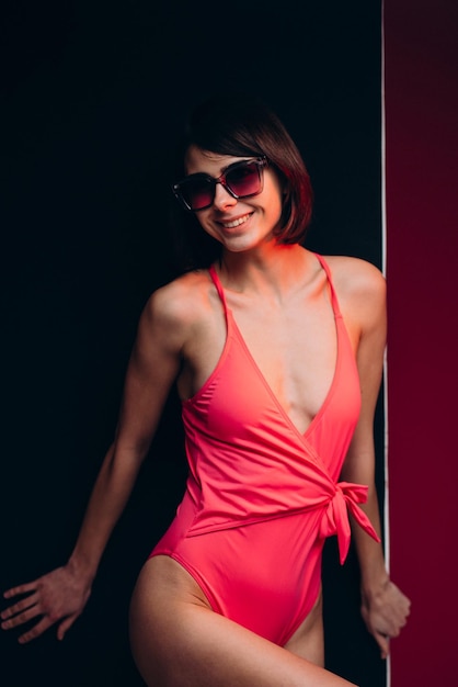 Woman in swimwear isolated in studio on background