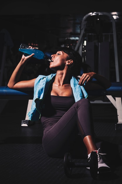 Woman taking a break in gym