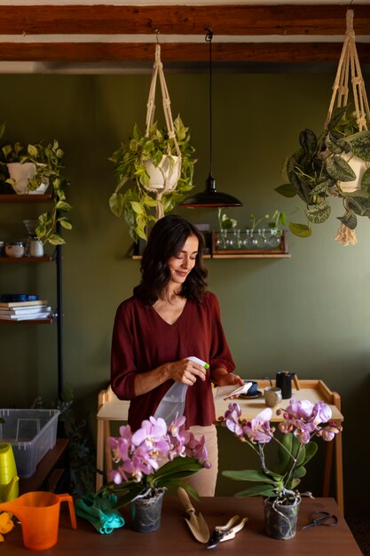 Woman taking care of exotic orchid