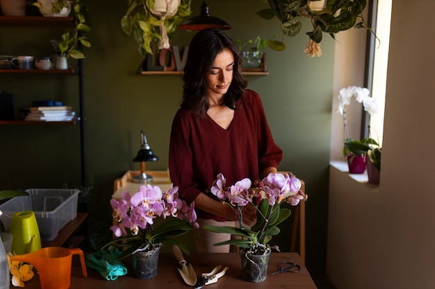 Woman taking care of exotic orchid