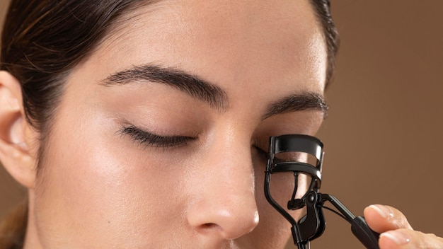 Woman taking care of her eyelashes