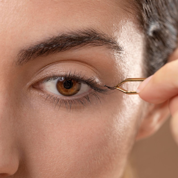 Woman taking care of her eyelashes