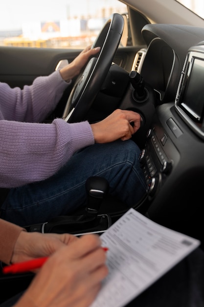 Free photo woman taking her driver's license test in vehicle