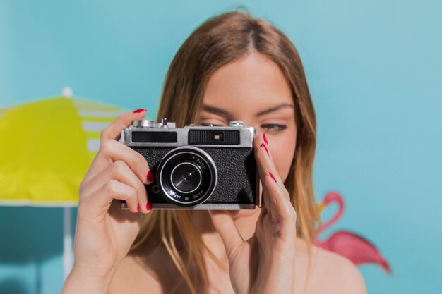 Woman taking photo on camera