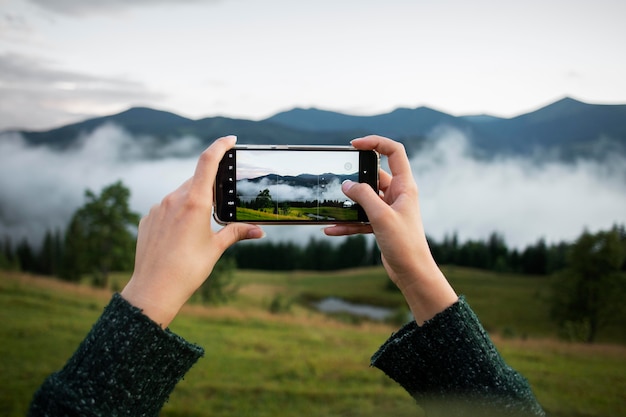 Woman taking a photo of the rural surroundings