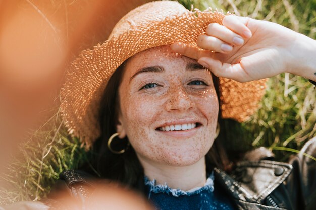 Woman taking a selfie in a park