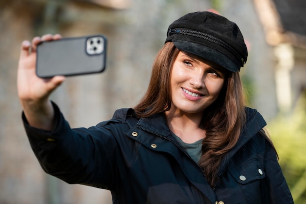 Free Photo woman taking a selfie while traveling