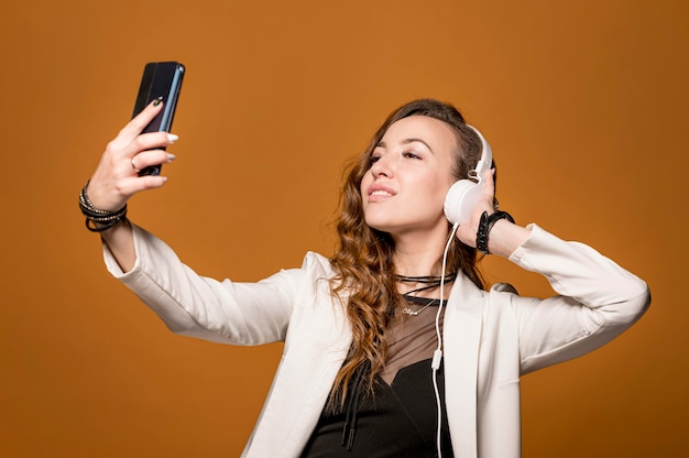 Woman taking selfie with  headphones