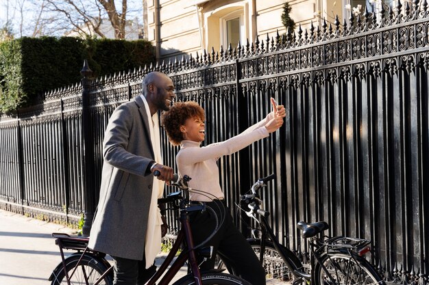 Woman taking selfie with man in the city in france