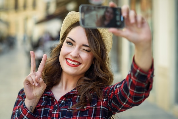 Free Photo woman taking a selfie