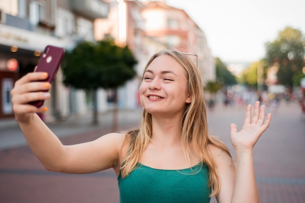 Free Photo woman taking a selfie