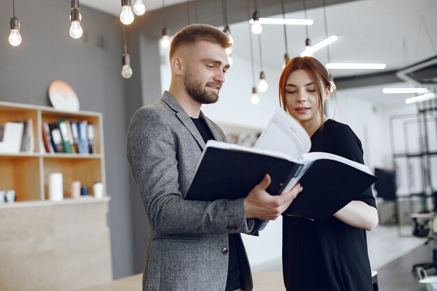 Woman talking to the director.Businessman with documents.Colleagues work together