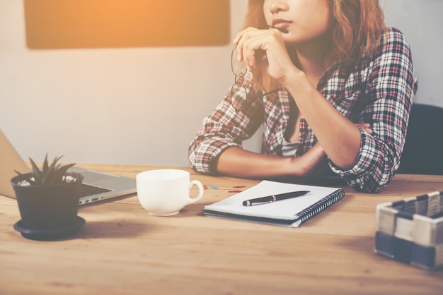 Woman thinking at work