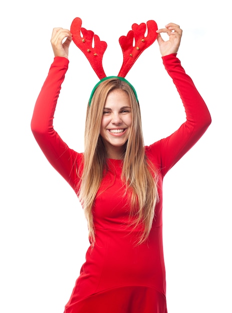 Free photo woman touching her reindeer antlers