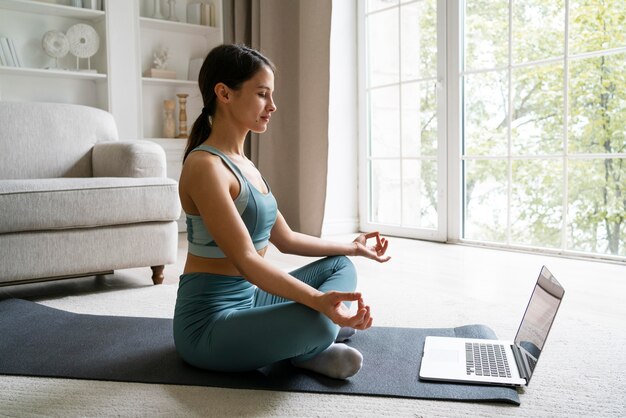 Woman training at home alone